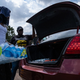 Residents distribute cases of water at Grove Park Community Center in Jackson, Mississippi, on September 3, 2022. - Jackson is enduring days without clean running water, with authorities urging those who still had supplies to shower with their mouths closed. The city, where 80 percent of the population is Black and poverty is rife, has been experiencing recurring water crises for years. But this week’s ordeal plunged Jackson into an emergency, with days of significant flooding disrupting the operation of a critical but aging water treatment plant.